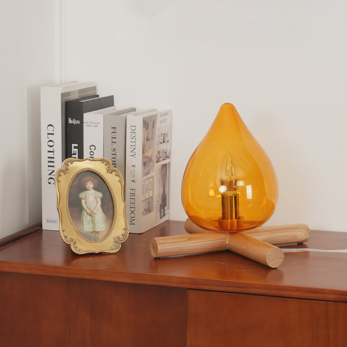 Orange flame-shaped glass table lamp with solid wood cross base 4