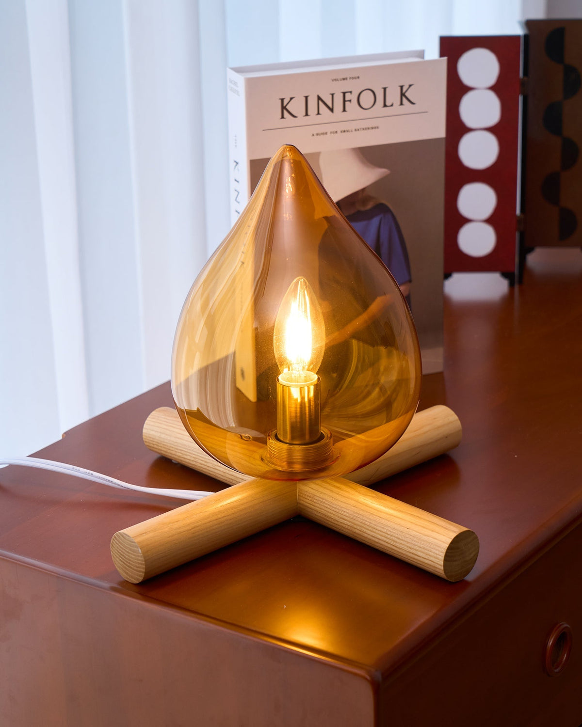 Orange flame-shaped glass table lamp with solid wood cross base 41