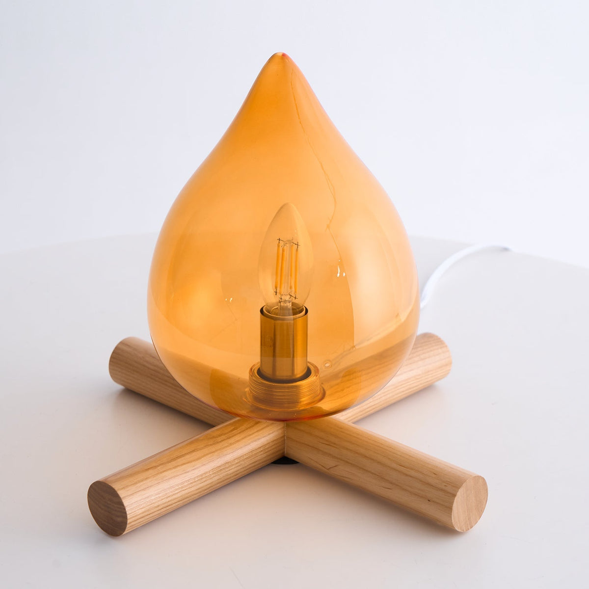 Orange flame-shaped glass table lamp with solid wood cross base 44