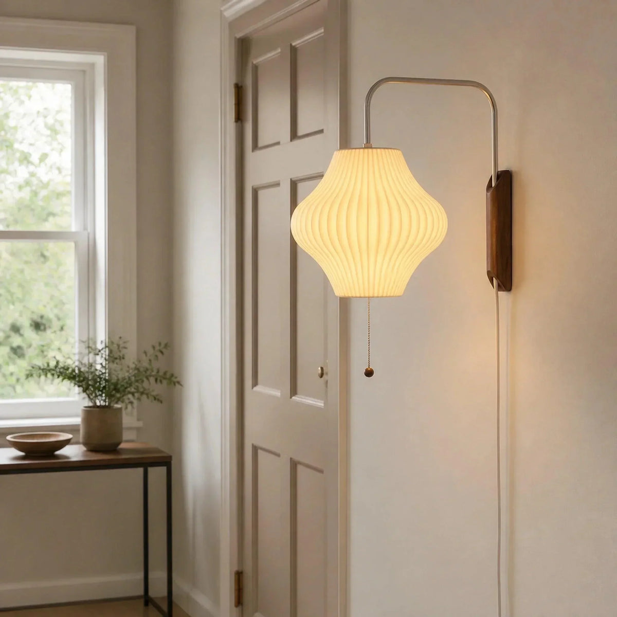 Ribbed bubble wall light beside a doorway