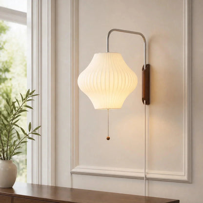 Bubble shade wall light on a panelled wall