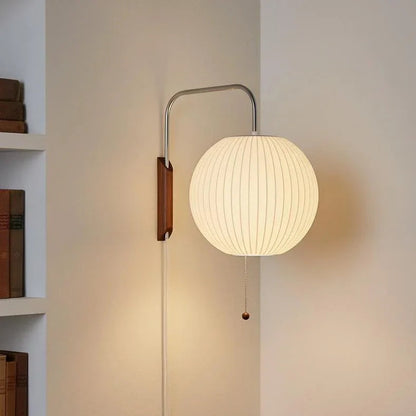 Round ribbed shade wall light with a pull chain