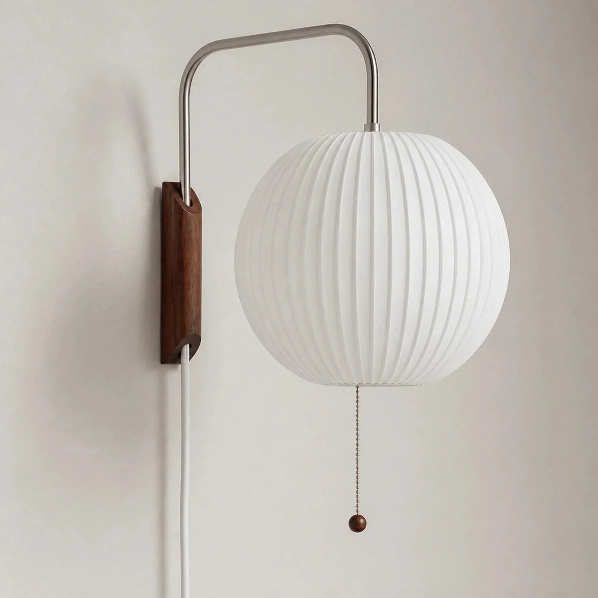 Unlit ribbed globe wall sconce with curved arm