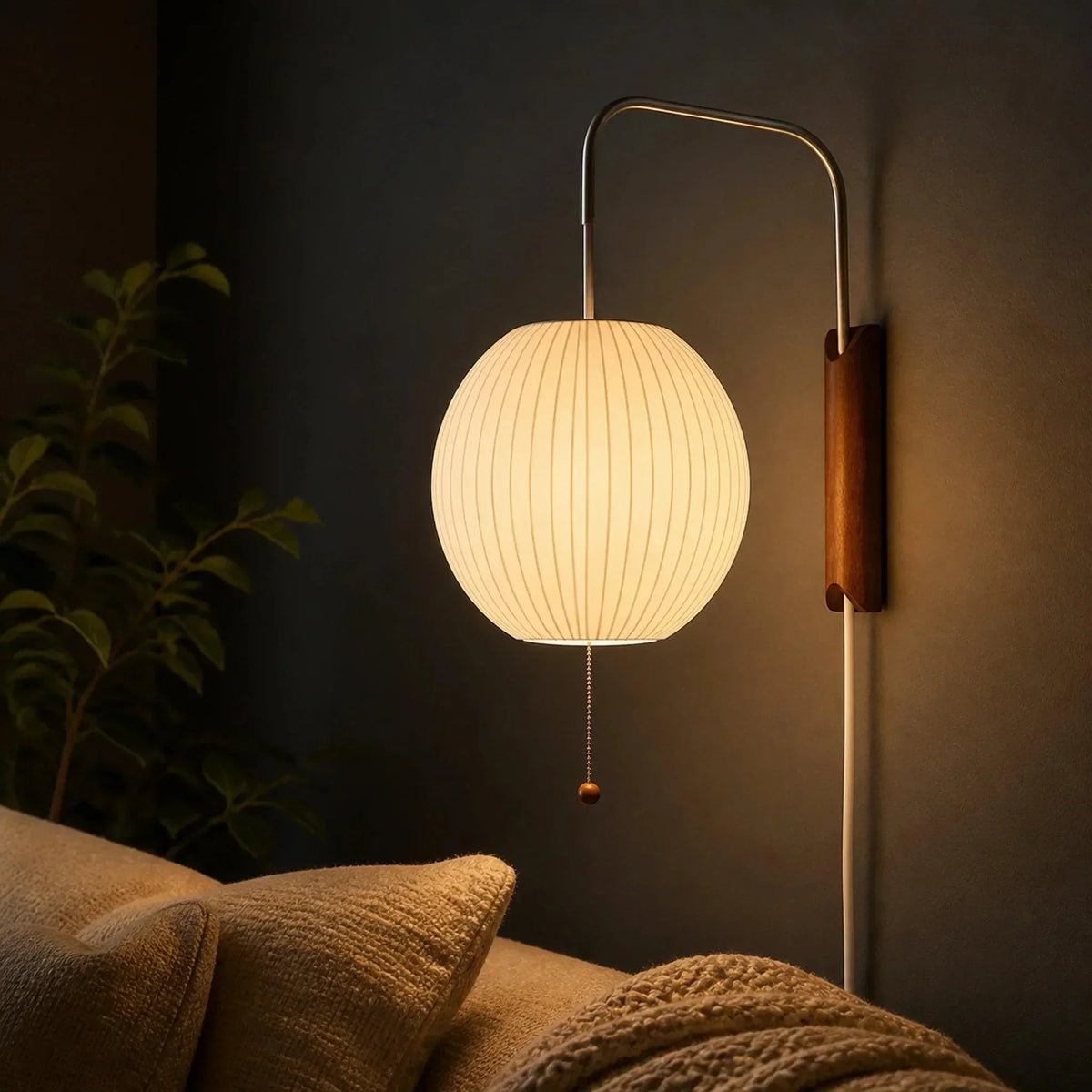 Glowing ribbed globe wall light over a sofa
