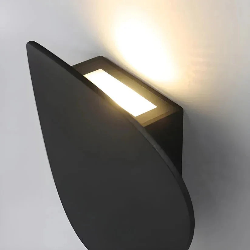 Concealed LED behind a pebble-shaped wall light