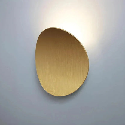 Gold pebble wall light with halo