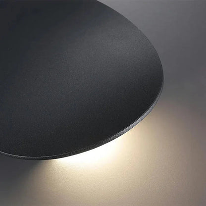 Textured black aluminium disc close-up