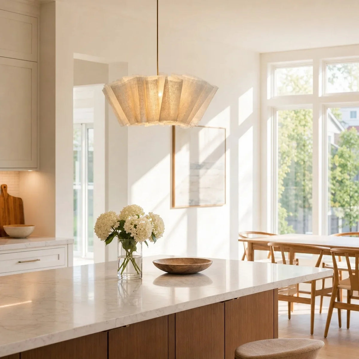 Pleated fabric pendant above a kitchen island
