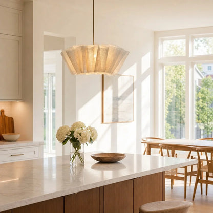 Pleated fabric pendant above a kitchen island