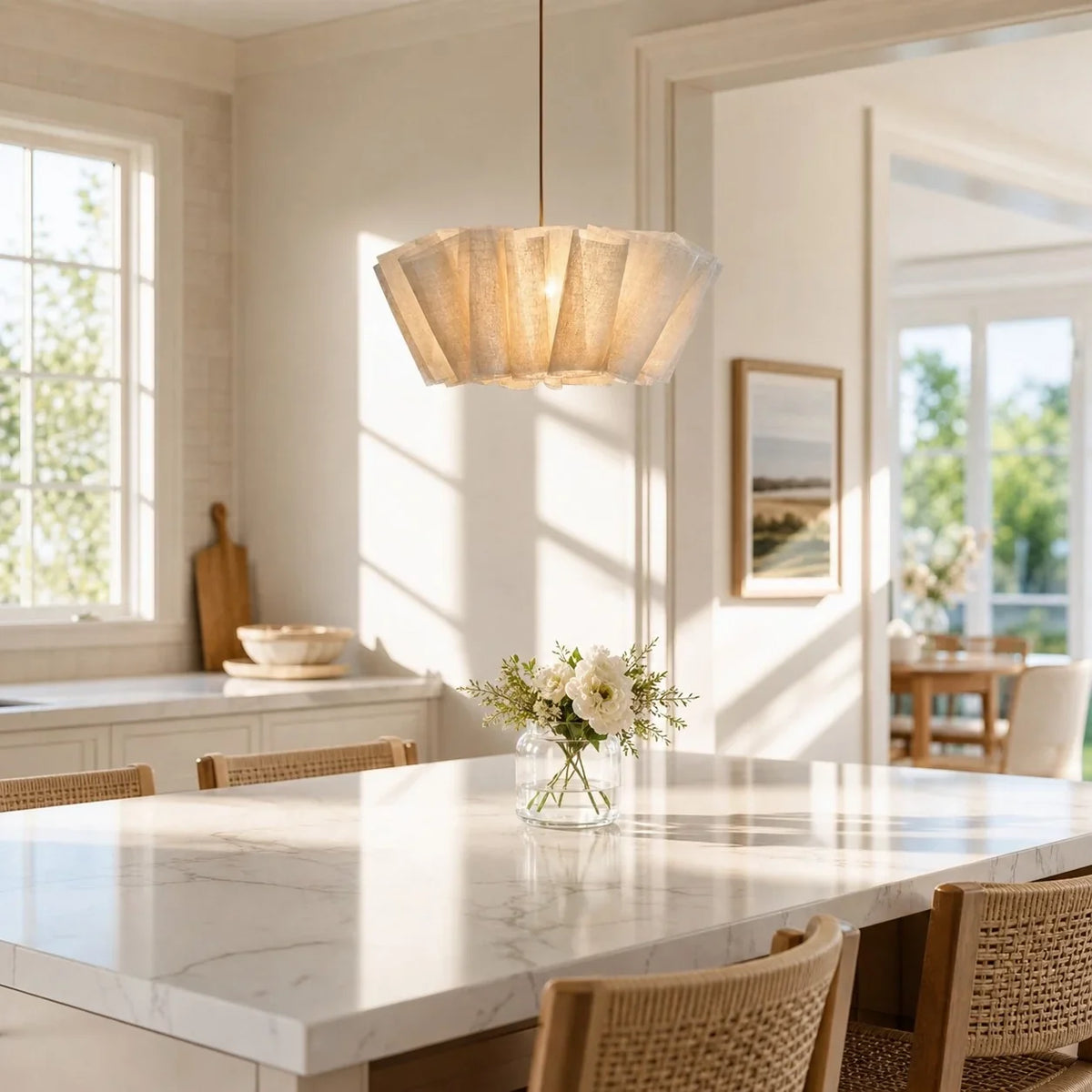Layered pleated pendant above a kitchen island