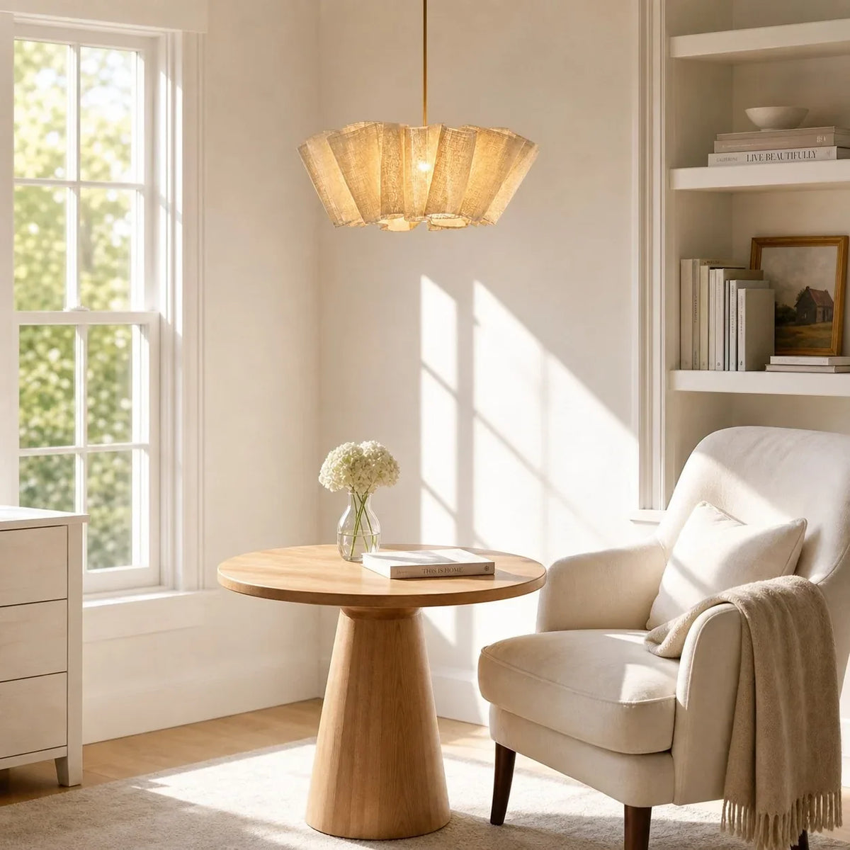 Pleated fabric pendant above a side table