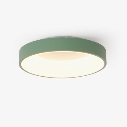 Green recessed-ring LED flush ceiling light mounted on a ceiling