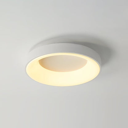 White recessed-ring LED flush ceiling light mounted on a ceiling