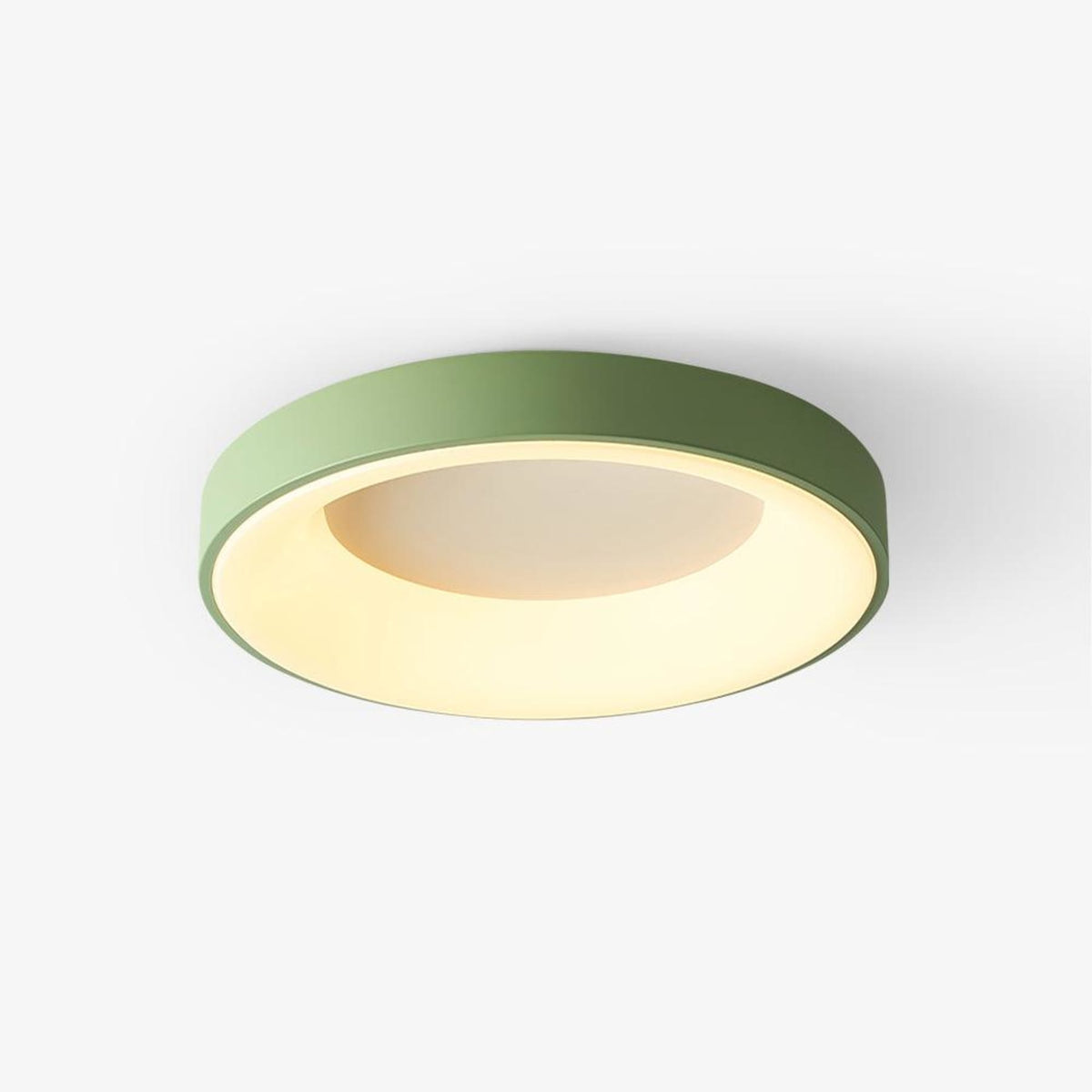 Green recessed-ring LED flush ceiling light mounted on a ceiling