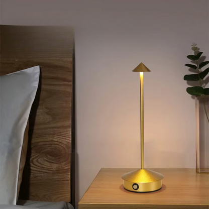 Gold aluminium cone table lamp with warm LED glow