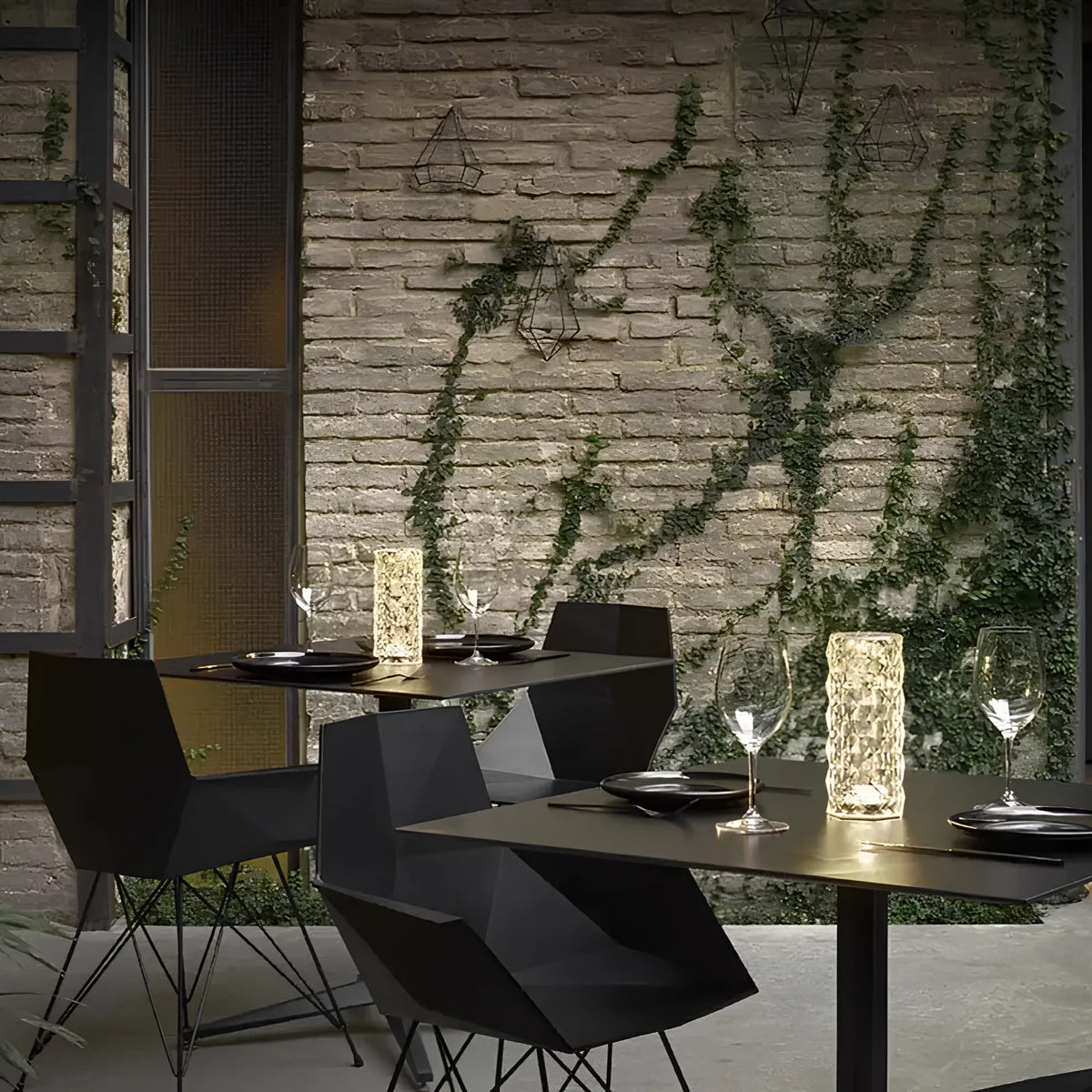 Faceted table lamps illuminating restaurant tables