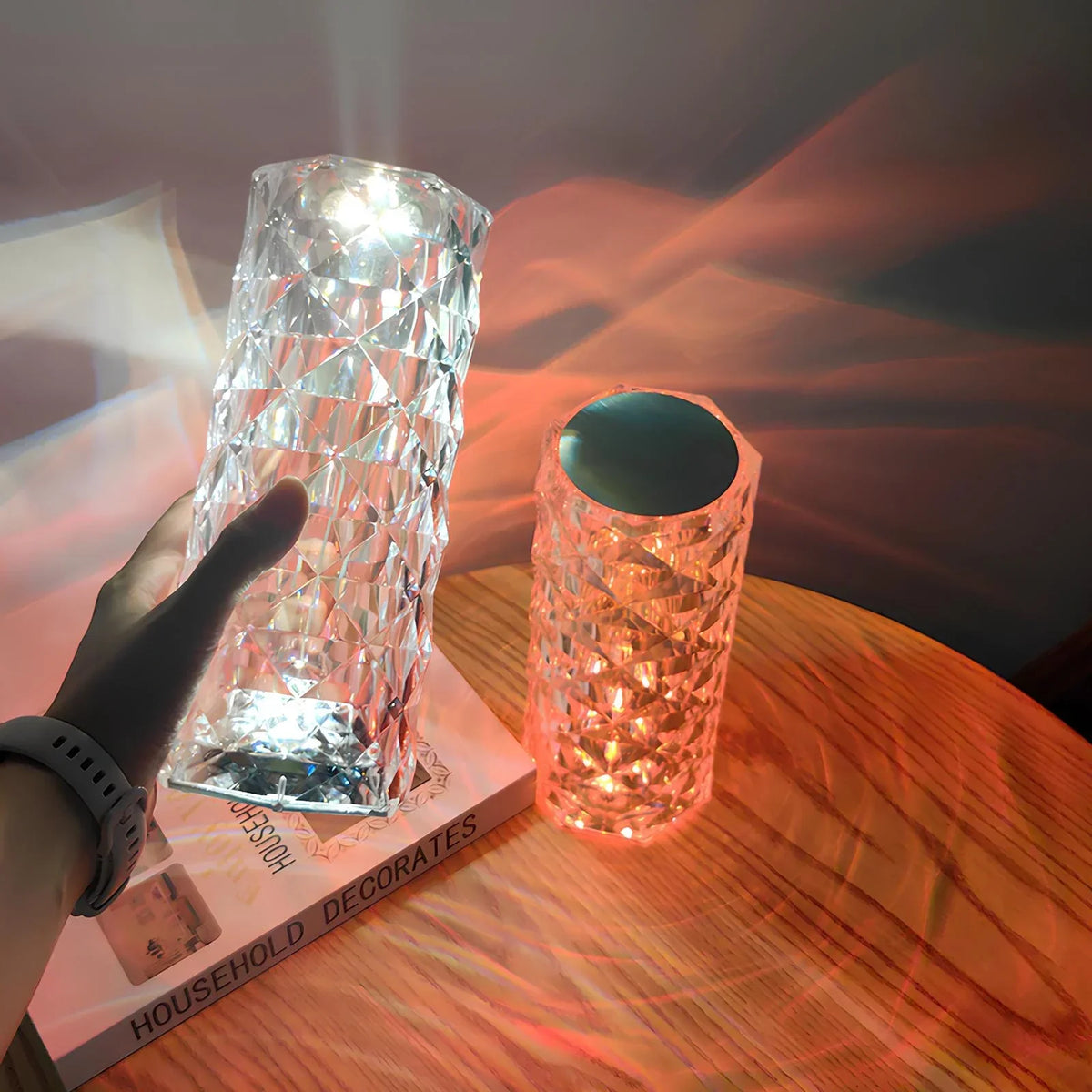 Two faceted cylinder lamps showing white and orange light