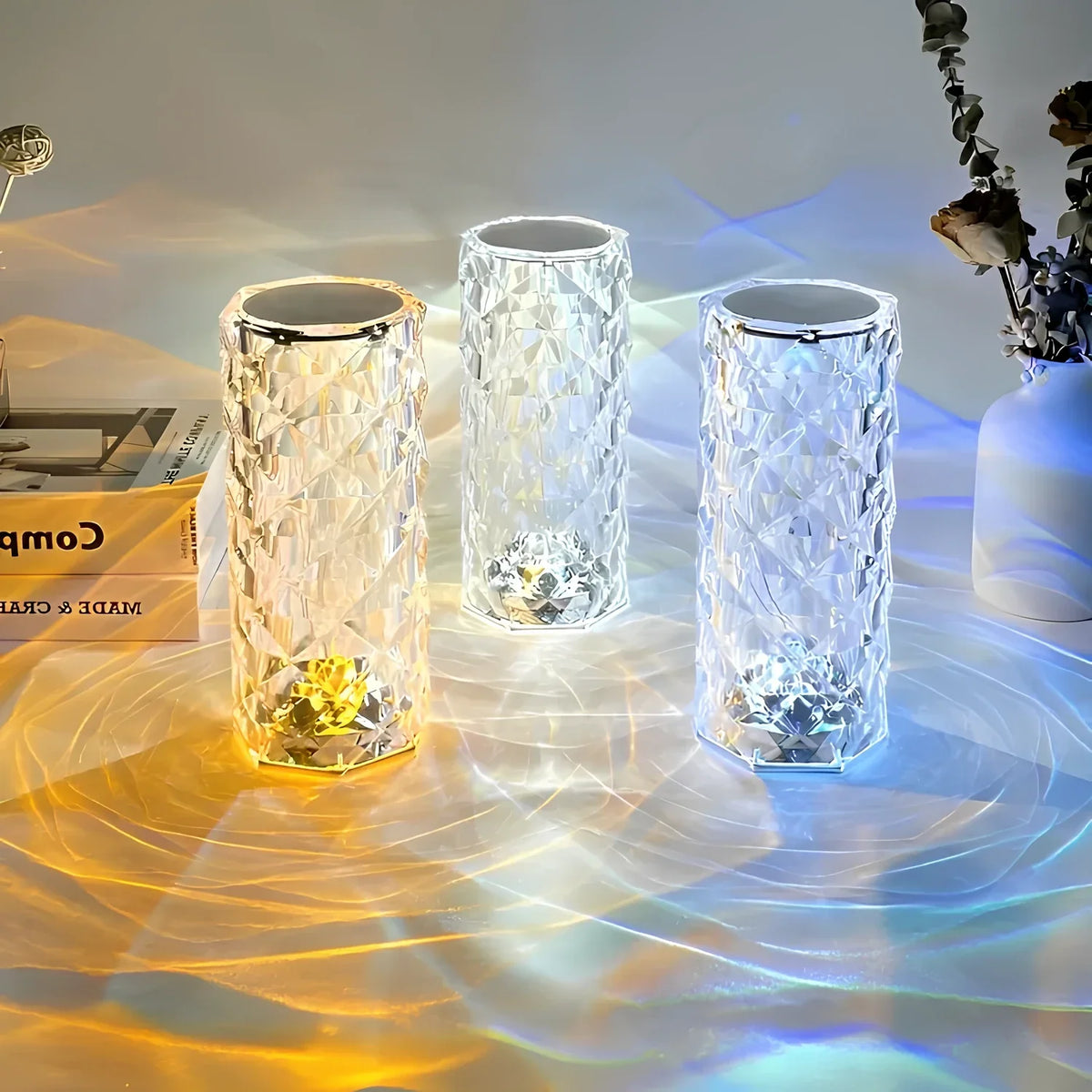 Three cylinder lamps showing warm, white and blue light