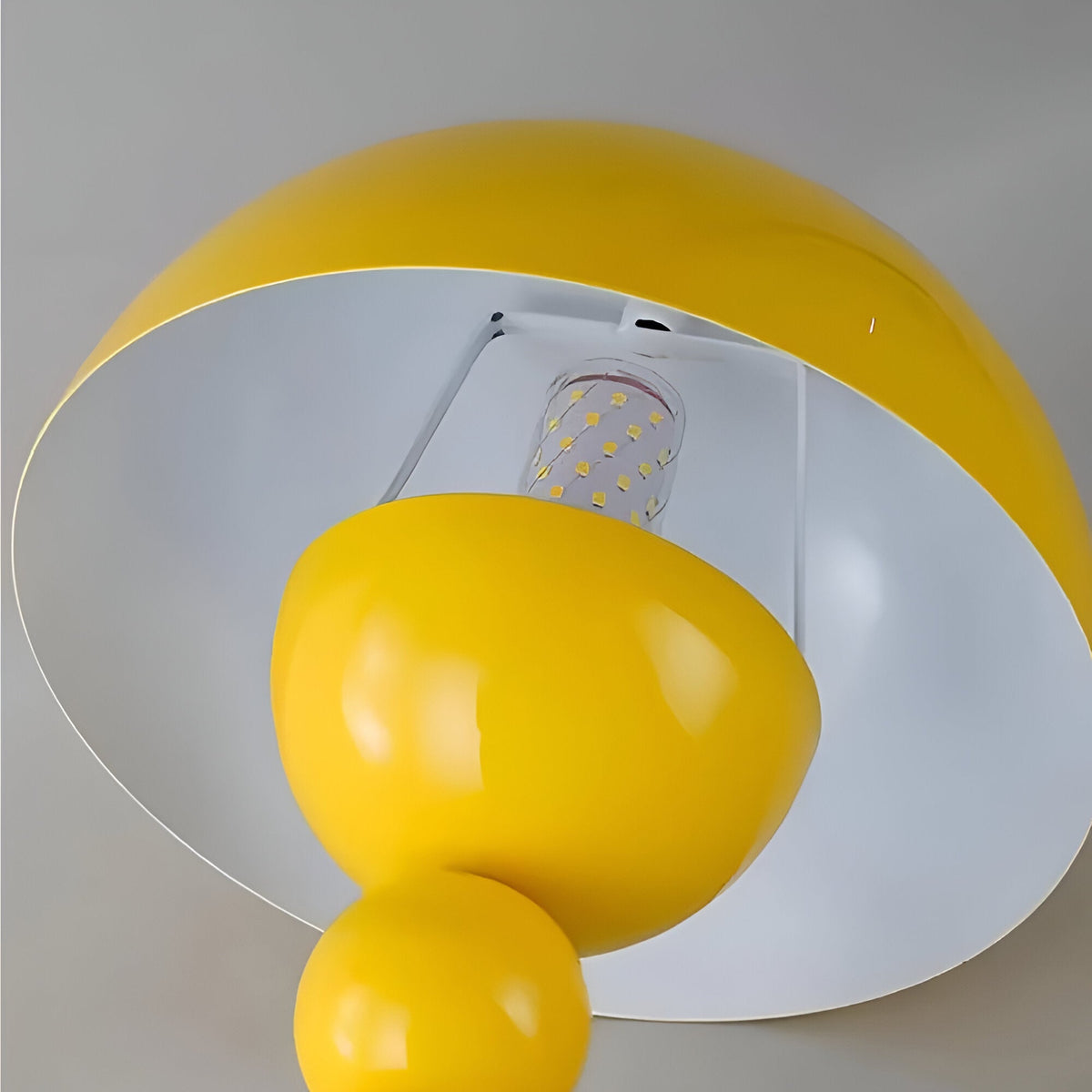 Underside of yellow dome shade with E27 bulb
