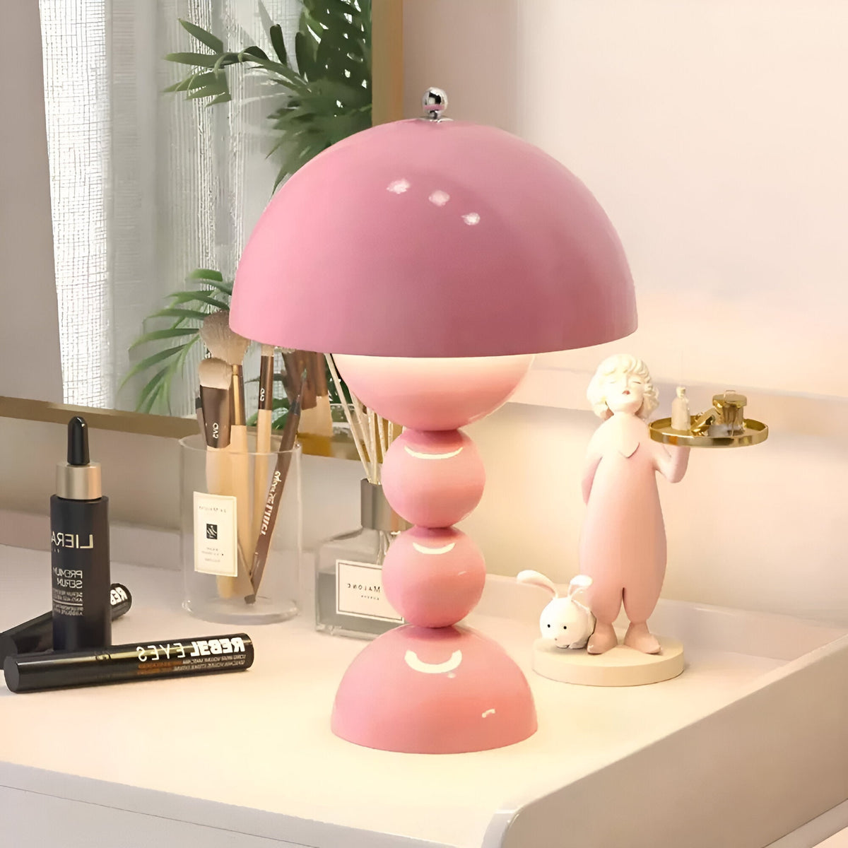 Pink dome table lamp with sculptural stacked sphere base