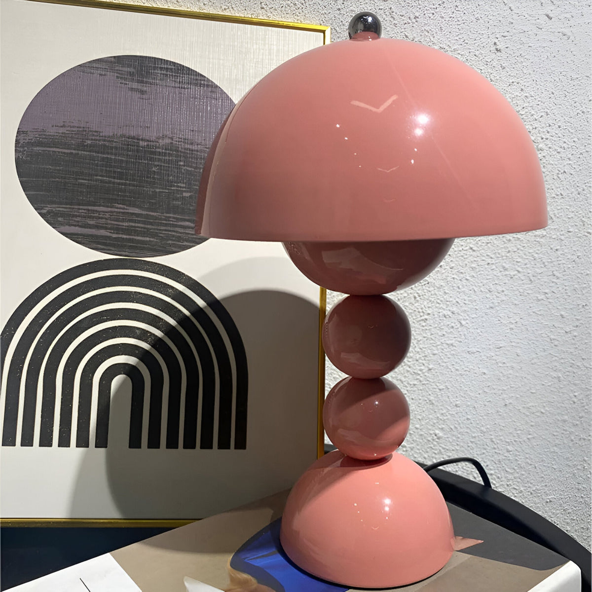 Pink dome table lamp with sculptural stacked sphere base
