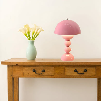 Pink dome table lamp with sculptural stacked sphere base