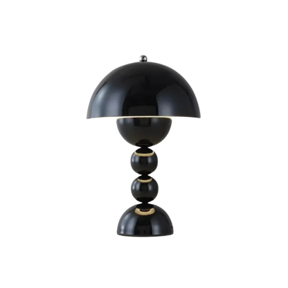 Black dome table lamp with sculptural stacked sphere base