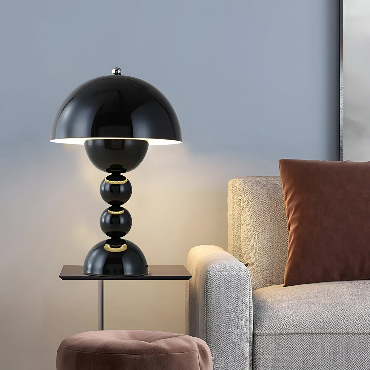 Black dome table lamp with sculptural stacked sphere base