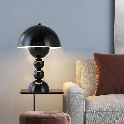 Black dome table lamp with sculptural stacked sphere base