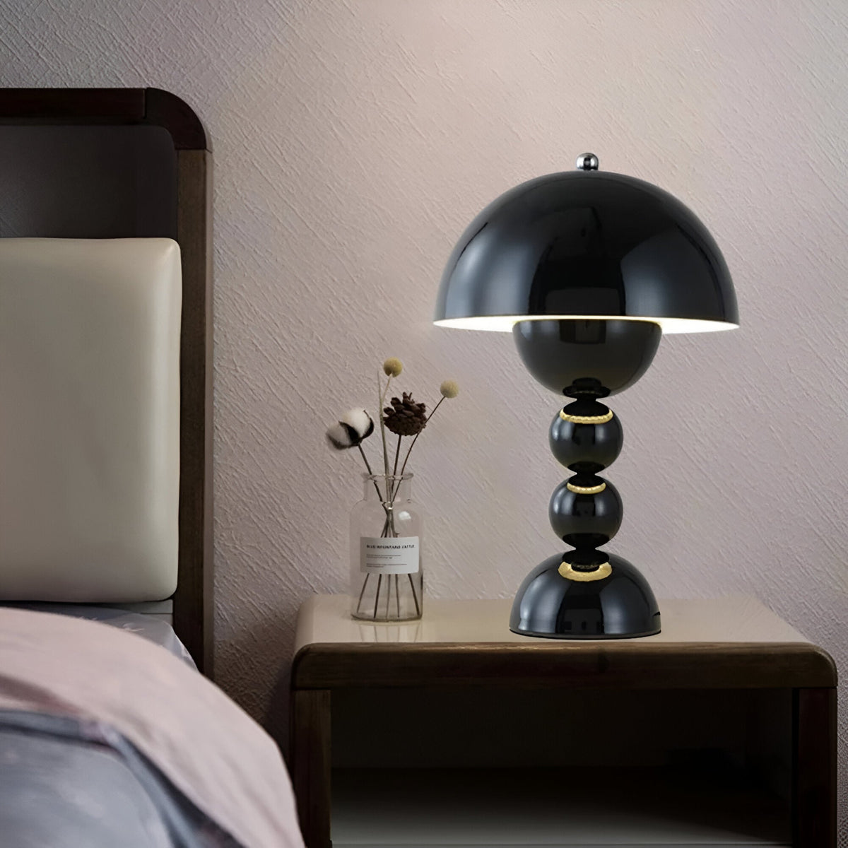 Black dome table lamp with sculptural stacked sphere base