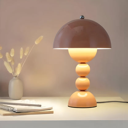 Pink dome table lamp with sculptural stacked sphere base