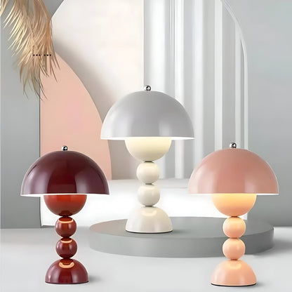 Dome table lamps in assorted finishes with stacked sphere bases