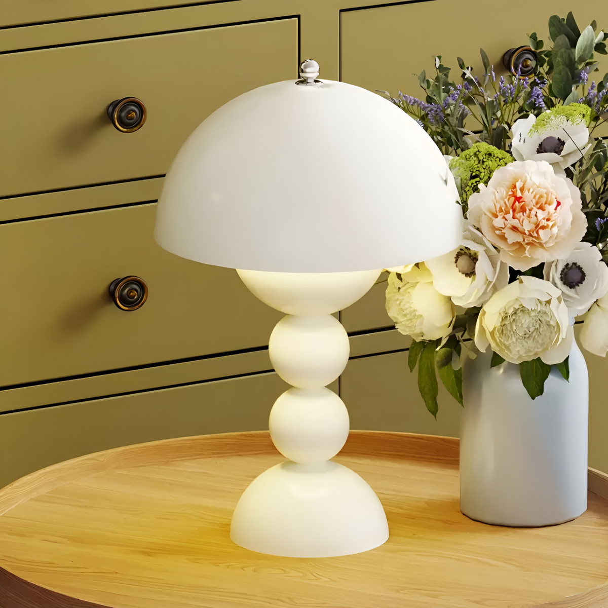 White dome table lamp with sculptural stacked sphere base