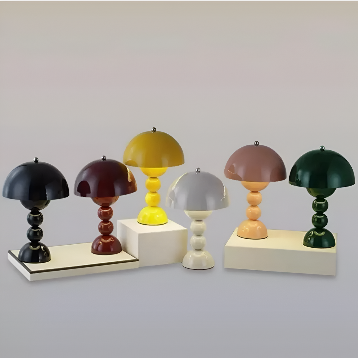 Dome table lamps in assorted finishes with stacked sphere bases