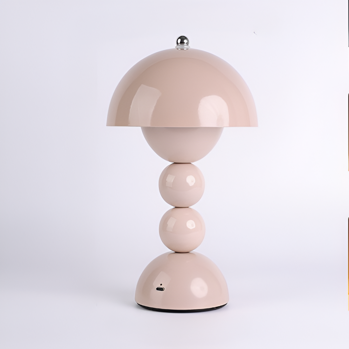 Pink dome table lamp with sculptural stacked sphere base