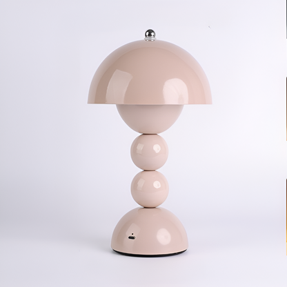 Pink dome table lamp with sculptural stacked sphere base