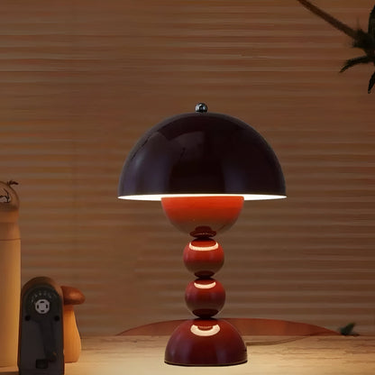 Red dome table lamp with sculptural stacked sphere base
