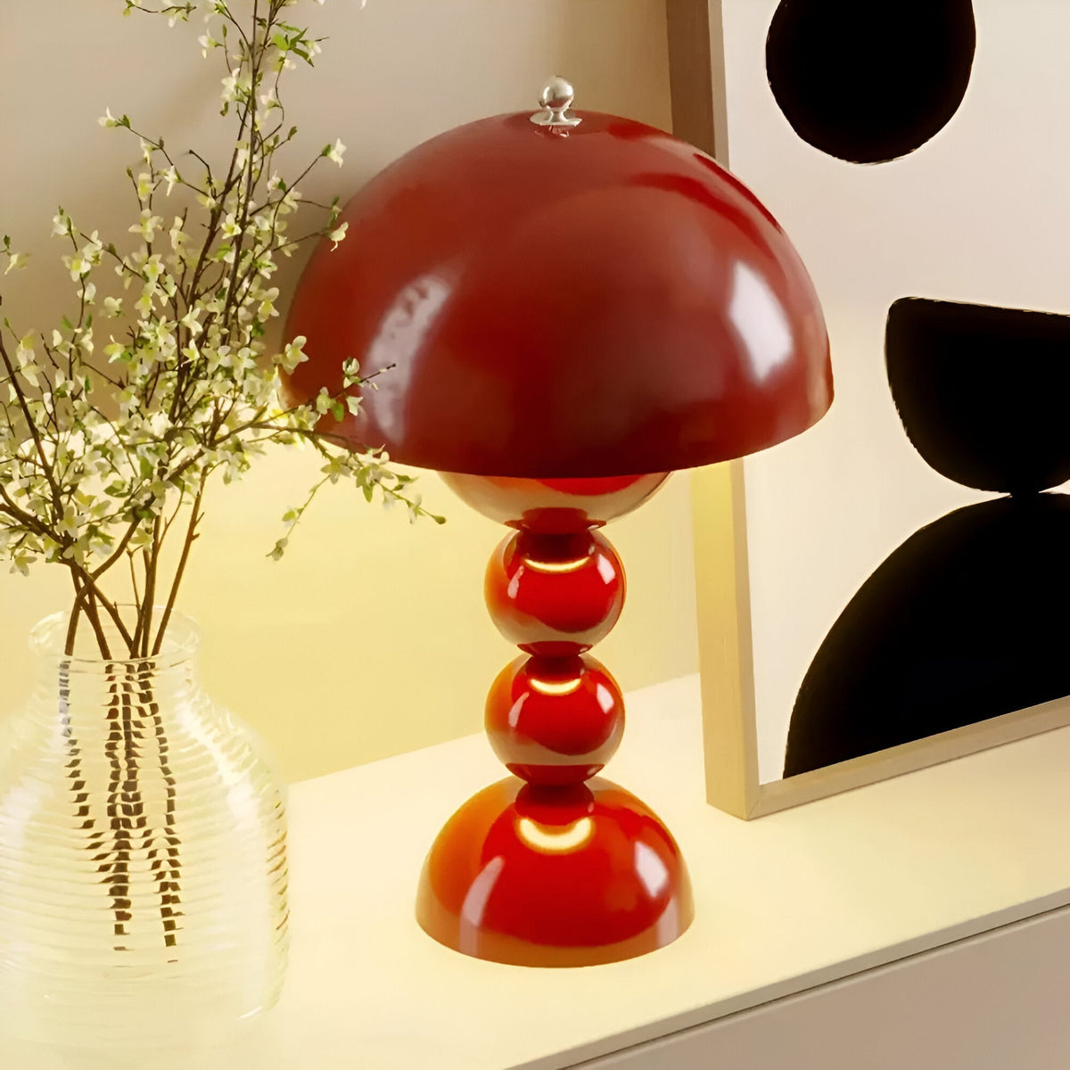 Red dome table lamp with sculptural stacked sphere base