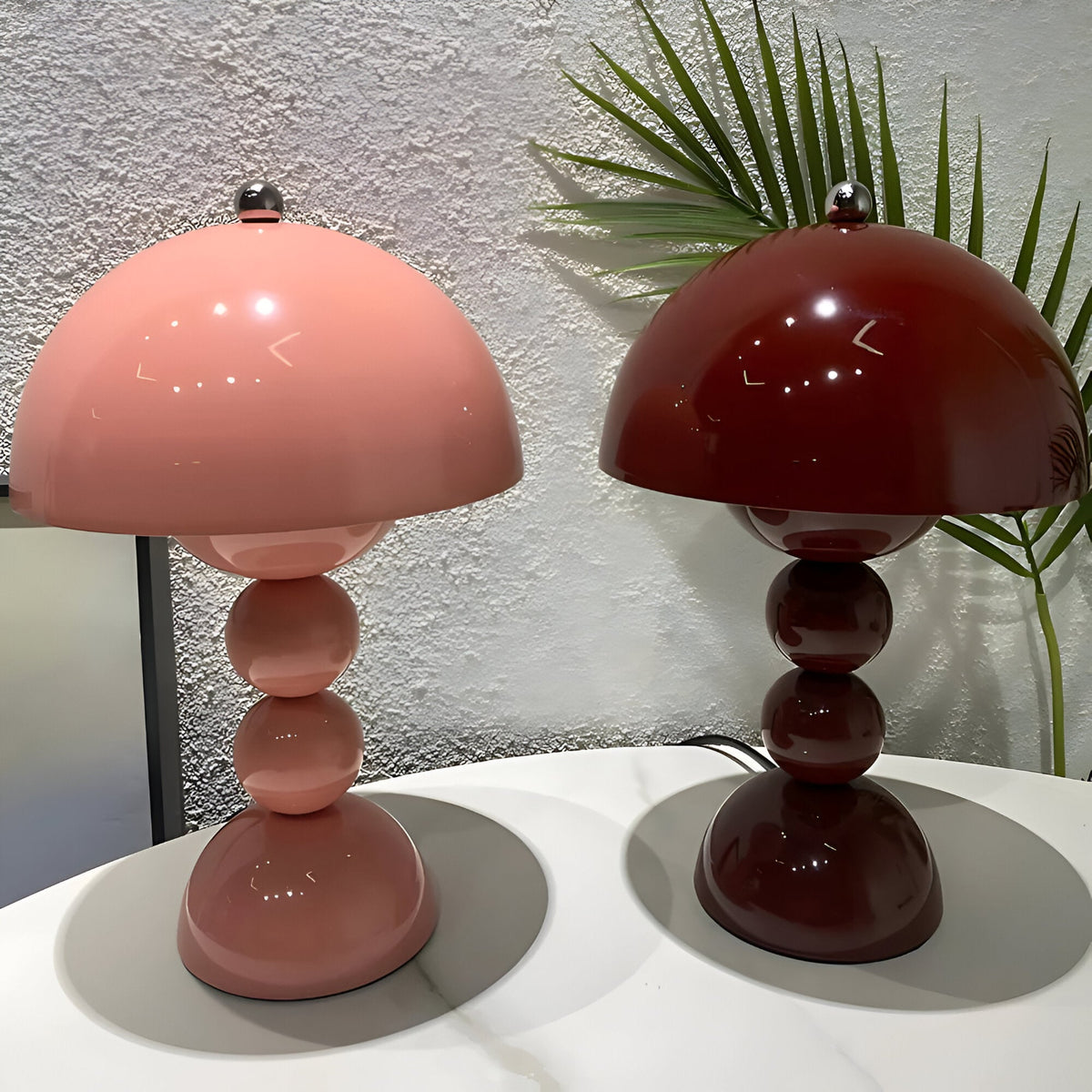 Dome table lamps in assorted finishes with stacked sphere bases