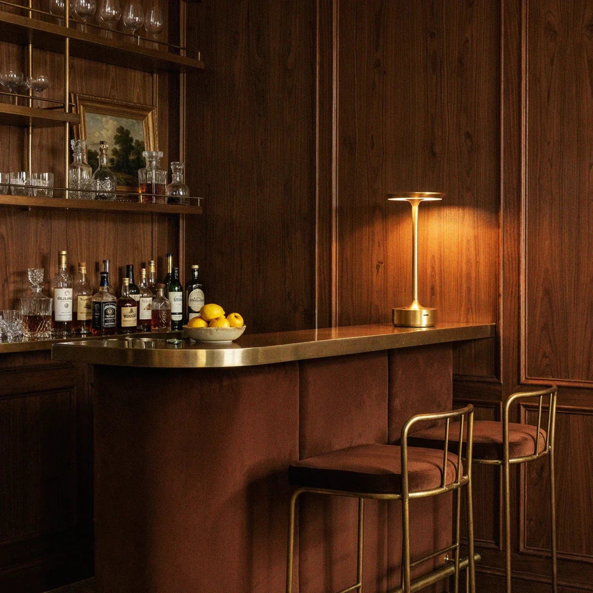 Gold rechargeable table lamp on a bar counter