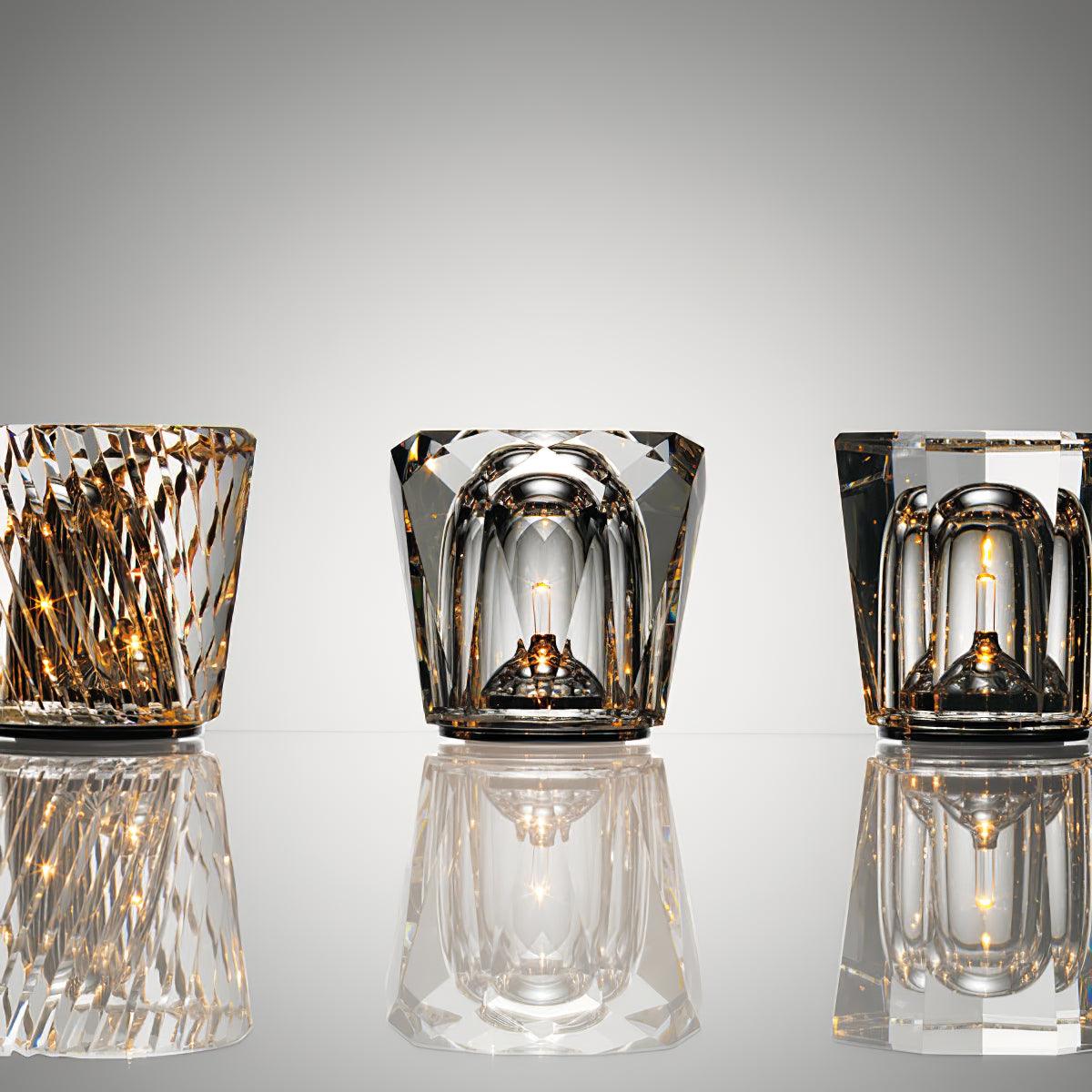 Three faceted crystal glass table lamp models with warm LED illumination
