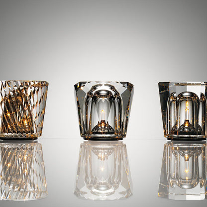 Three faceted crystal glass table lamp models with warm LED illumination