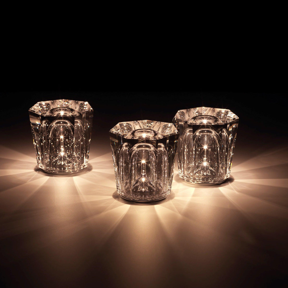 Three faceted crystal glass table lamp models with warm LED illumination