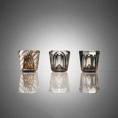 Three faceted crystal glass table lamp models with warm LED illumination