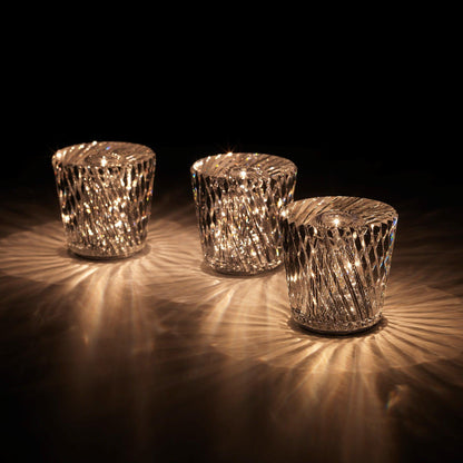 Three faceted crystal glass table lamp models with warm LED illumination