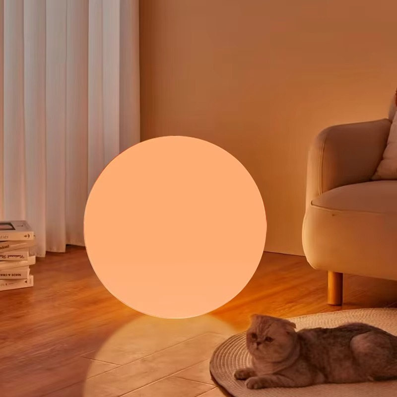 Round LED lamp with warm orange illumination