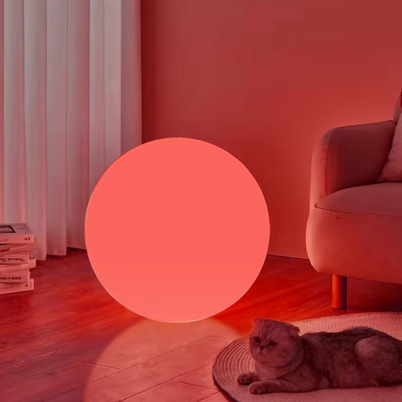 Cordless moon-style table lamp glowing red