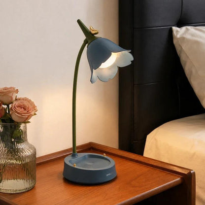Blue flower desk lamp beside a bed
