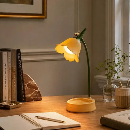 Yellow flower lamp on a writing desk
