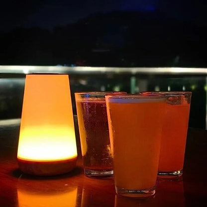 Warm glowing night light beside drinks